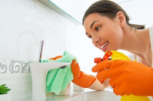 Cleaner preparing carpet cleaning equipment safely before use