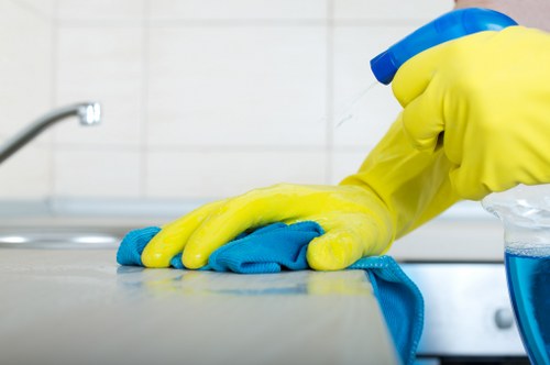 Cleaner inspecting carpet and equipment for safe operation
