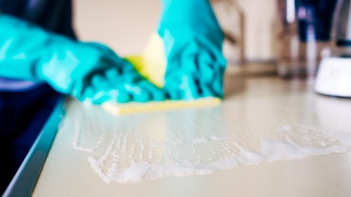 Technician performing mattress cleaning in Cheam
